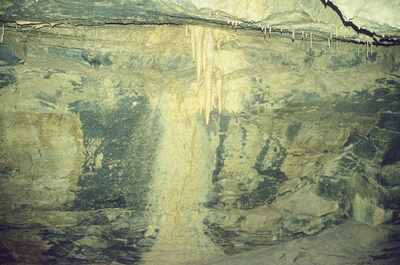 A cascade of flowstone and stalactites in a cave chamber — Ireland, Ireland (4-9 July 2000)