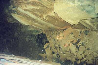 Jagged rock ceiling and rubble inside a cave — Ireland, Ireland (4-9 July 2000)