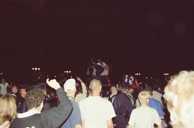 Night crowd waving tricolour flags during a World Cup celebration — Paris, France (2-8 July 2000)