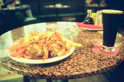 A plate of chips with gravy and a pint of Guinness — Dublin, Ireland (29 June - 6 July 2000)