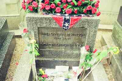 The flower-piled headstone of James Douglas Morrison — Paris, France (29 June - 6 July 2000)