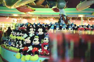 Shelves of plush Mickey and Minnie toys in a Disney shop — Disneyland Paris, France (29 June - 6 July 2000)