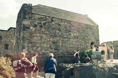 St Margaret's Chapel and visitors on the castle rock — Edinburgh, Scotland (August 2000)