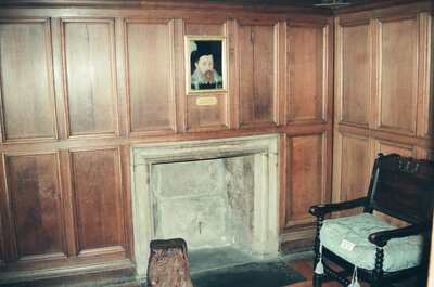 A panelled chamber with a portrait above the fireplace — Edinburgh, Scotland (August 2000)