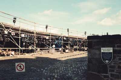 The scaffolded Half-Moon Battery behind a stone marker — Edinburgh, Scotland (August 2000)
