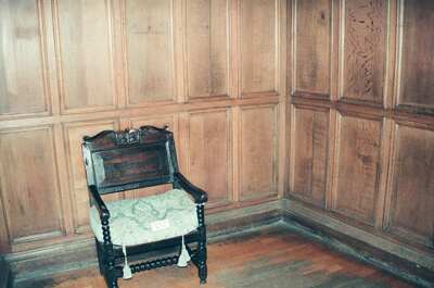A carved ceremonial chair against oak panelling — Edinburgh, Scotland (August 2000)