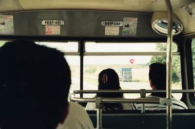 A country road seen through the front of a tour bus — Salisbury Plain area, England (mid-August 2000)
