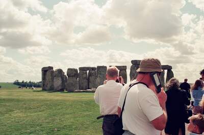 Visitors photographing the standing stones of Stonehenge — Stonehenge, England (mid-August 2000)