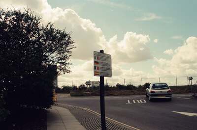 A multilingual sign at the Stonehenge car park — Stonehenge, England (mid-August 2000)