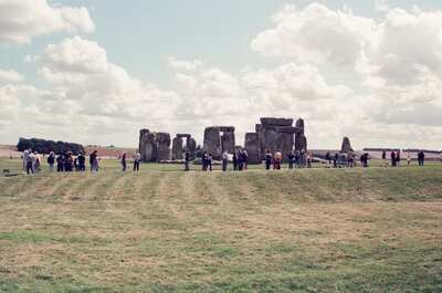Visitors circling Stonehenge across the mown grass — Stonehenge, England (mid-August 2000)