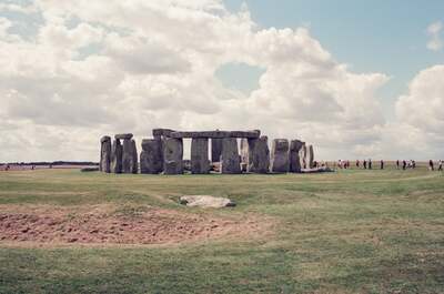 Stonehenge with visitors strolling around the stone circle — Stonehenge, England (mid-August 2000)