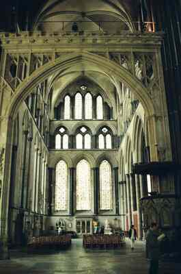 Tall lancet windows glowing in the cathedral interior — Salisbury, England (mid-August 2000)