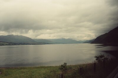 Storm clouds over a broad sea loch and distant hills — Scottish Highlands, Scotland (late July 2000)