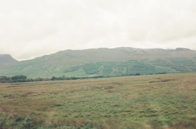 Open moorland stretching to a long Highland ridge — Scottish Highlands, Scotland (late July 2000)
