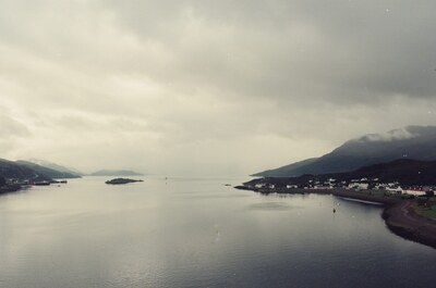 The arching Skye Bridge seen across the water — Kyle of Lochalsh, Scotland (late July 2000)
