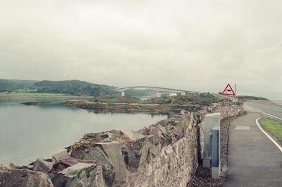 A misty sea loch with a small town along the shore — Kyle of Lochalsh, Scotland (late July 2000)