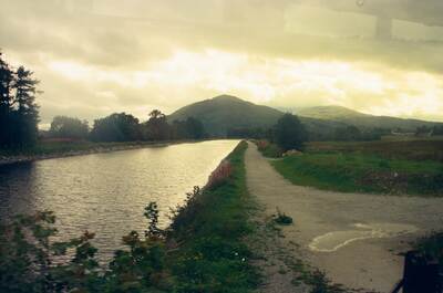 The Caledonian Canal towpath leading toward golden hills — Fort William, Scotland (August 2000)