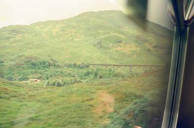 The Glenfinnan Viaduct seen from a moving train window — Glenfinnan, Scotland (August 2000)