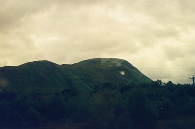 The dark bulk of Ben Nevis under heavy cloud — Fort William, Scotland (August 2000)
