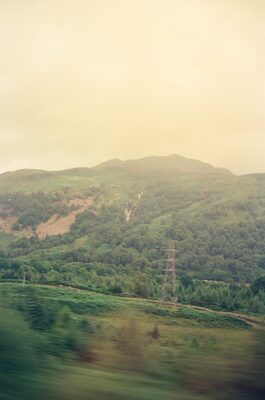 A wooded river valley under hazy summer light — England, England (August 2000)