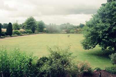 A broad walled lawn in an Oxford college garden — Oxford, England (August 2000)