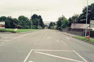 An empty road approaching the Aberystwyth university — Aberystwyth, Wales (August 2000)