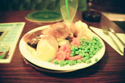 A pub Sunday roast plate with peas and carrots — Wales/England, Wales (August 2000)