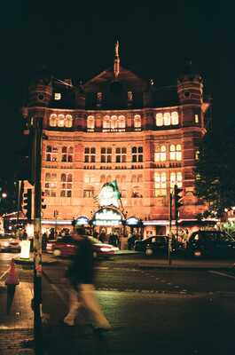 An ornate illuminated building lit up at night — London, England (August 2000)