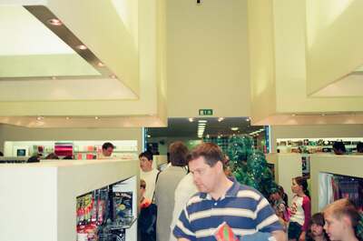 Richard browsing displays in a busy record store — London, England (August 2000)