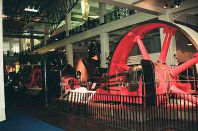 A huge red mill engine flywheel in the Science Museum — London, England (August 2000)