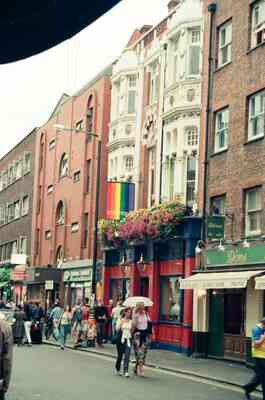 A rainbow Pride flag above Old Compton Street, Soho — London, England (August 2000)