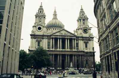 St Paul's Cathedral framed by city buildings — London, England (August 2000)