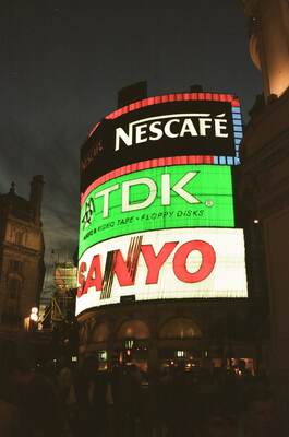 Illuminated Nescafe and Sanyo signs at Piccadilly Circus — London, England (August 2000)