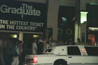 A white limousine outside the Gielgud Theatre at night — London, England (August 2000)
