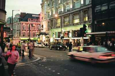 Dusk on Shaftesbury Avenue, the Apollo and Gielgud theatres — London, England (August 2000)