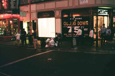 A Cecil Gee shop closing down at night on Shaftesbury Avenue — London, England (August 2000)