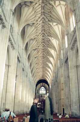 A visitor walking the vaulted cathedral nave — Winchester, England (August 2000)