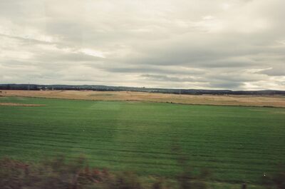 Cloudy sky over green Aberdeenshire farmland — Aberdeen, Scotland (late July - early August 2000)