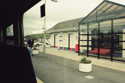 A man walking the platform at Keith station — Moray, Scotland (late July - early August 2000)