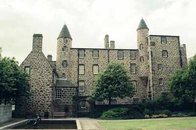 Provost Skene's House with its turrets behind a reflecting pool — Aberdeen, Scotland (late July - early August 2000)