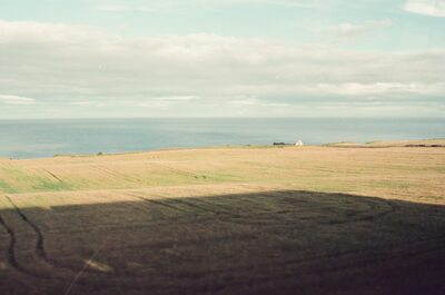 Rolling coastal fields meeting the sea near Stonehaven — Aberdeen, Scotland (late July - early August 2000)