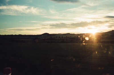 A glowing sunset over rolling Aberdeenshire hills — Aberdeen, Scotland (late July - early August 2000)