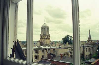 Tom Tower framed through an open sash window — Oxford, England (mid-August 2000)