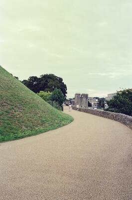 A grassy bank sloping down to the River Stour — Canterbury, England (mid-August 2000)