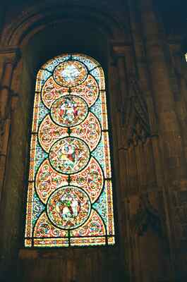 A jewel-toned roundel stained glass window — Canterbury, England (mid-August 2000)