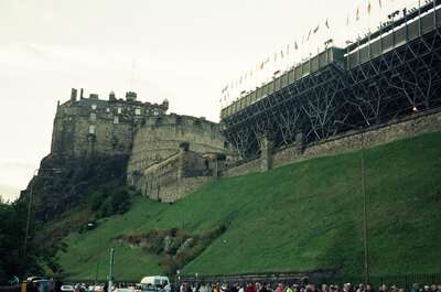 Edinburgh Castle above its grassy slope and tattoo stands — Edinburgh, Scotland (August 2000)
