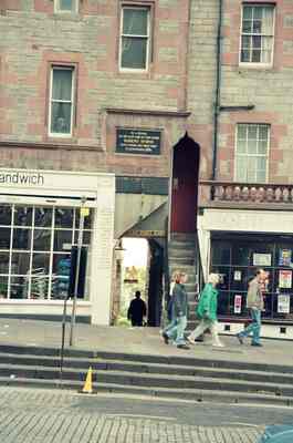 Pedestrians passing shopfronts along the Royal Mile — Edinburgh, Scotland (August 2000)