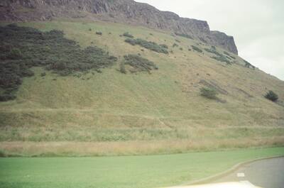 The grassy slopes and crags below Arthur's Seat — Edinburgh, Scotland (August 2000)