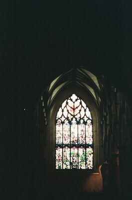 A Gothic stained glass window glowing in St Giles' Cathedral — Edinburgh, Scotland (August 2000)