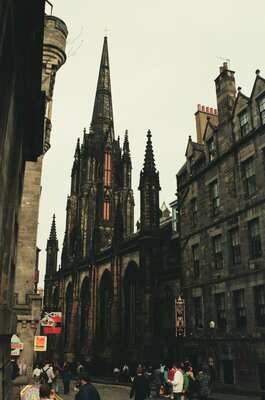The crown spire of St Giles' Cathedral against grey sky — Edinburgh, Scotland (August 2000)